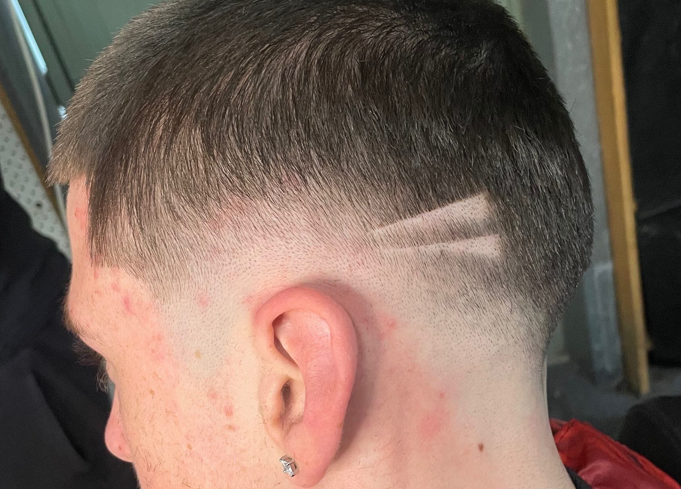 Stylish precision haircut at EFRO CUTS, Melbourne, Victoria, AU, showcasing detailed line design.