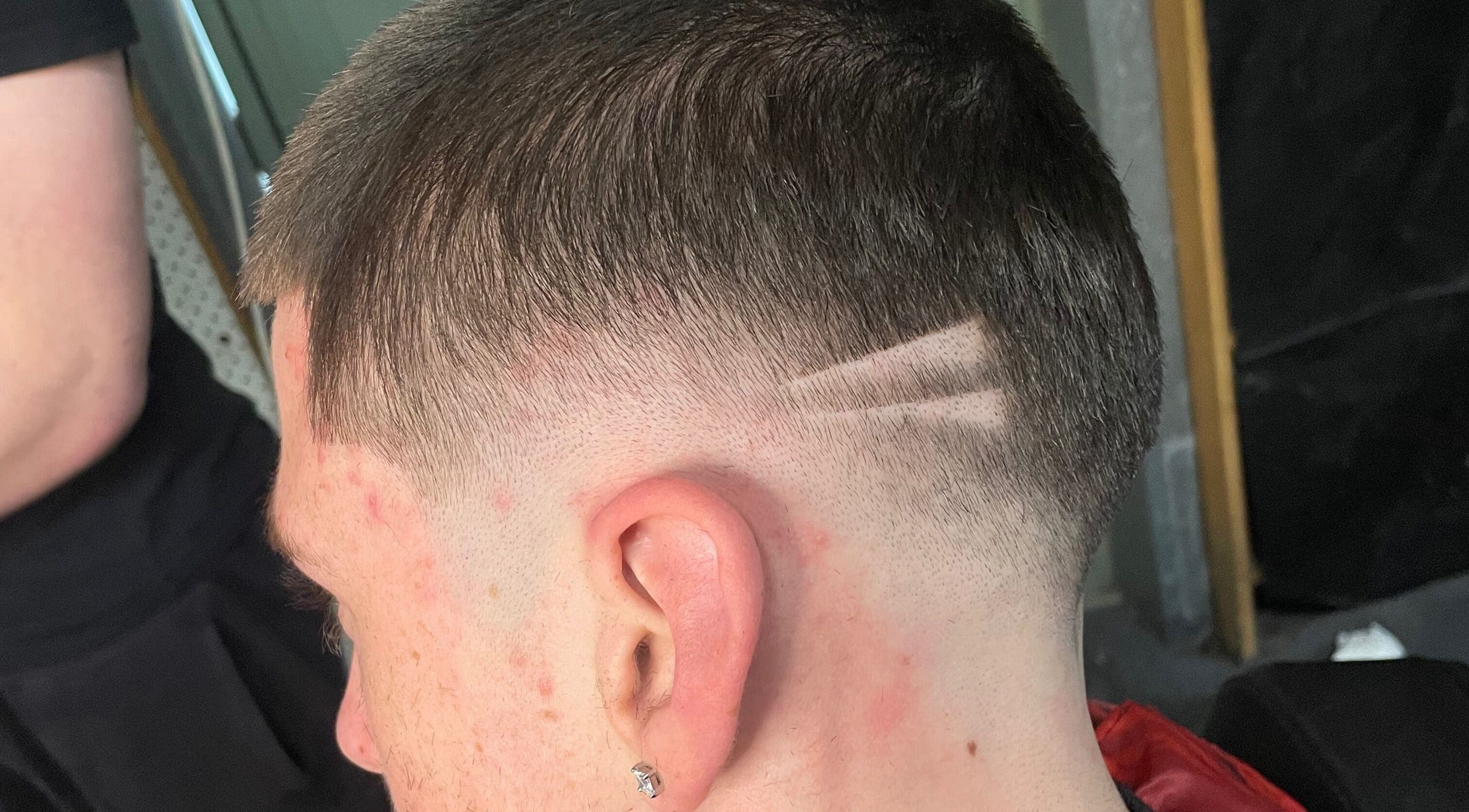 Stylish precision haircut at EFRO CUTS, Melbourne, Victoria, AU, showcasing detailed line design.