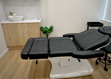 Luxury treatment room at Beauty by Maggie, Sunnybank Hills QLD, Queensland, AU, featuring a sleek black chair.
