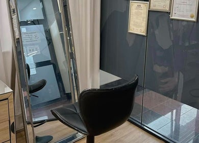 Elegant salon setup at Beauty by Maggie in Sunnybank Hills QLD, Queensland, AU featuring a stylish chair and mirror.