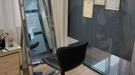 Elegant salon setup at Beauty by Maggie in Sunnybank Hills QLD, Queensland, AU featuring a stylish chair and mirror.
