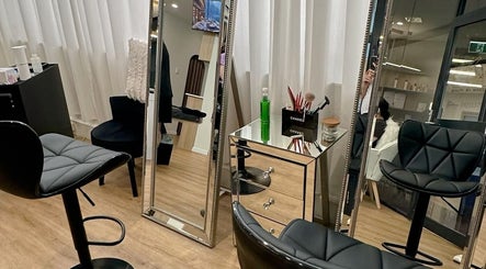 Sleek beauty salon interior at Beauty by Maggie, Sunnybank Hills QLD, Queensland, AU with modern styling chairs.