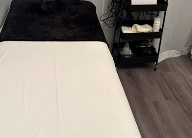 Cozy treatment room at Sculpte Society, Warnbro, Western Australia, AU. Features massage bed and wellness essentials.