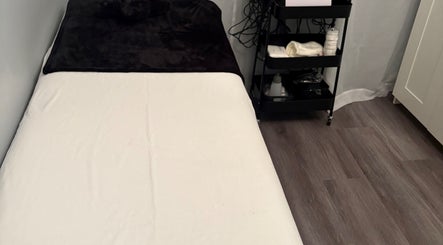 Cozy treatment room at Sculpte Society, Warnbro, Western Australia, AU. Features massage bed and wellness essentials.