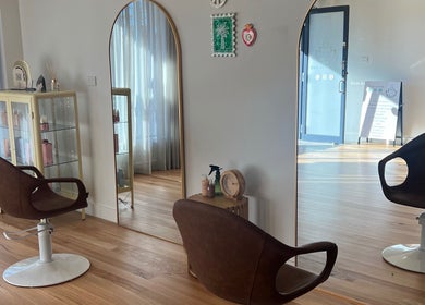 Modern salon interior at Spiritual Soul Hair Co - Gerringong, Gerringong, New South Wales, AU with sleek chairs and mirrors.
