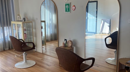 Modern salon interior at Spiritual Soul Hair Co - Gerringong, Gerringong, New South Wales, AU with sleek chairs and mirrors.