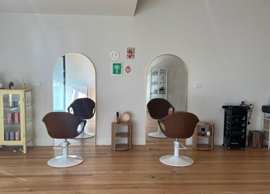 Elegant salon chairs and sleek mirrors at Spiritual Soul Hair Co - Gerringong, New South Wales, AU.