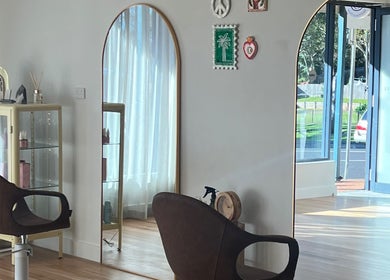 Inside view of Spiritual Soul Hair Co - Gerringong, featuring stylish chairs and large mirrors in Gerringong, NSW, AU.