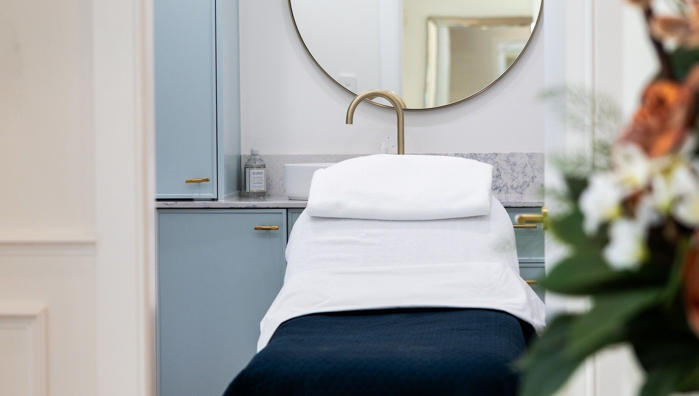 Relaxing treatment room at Studio Ap & Co, Neutral Bay, New South Wales, AU, features a plush spa bed and elegant decor.