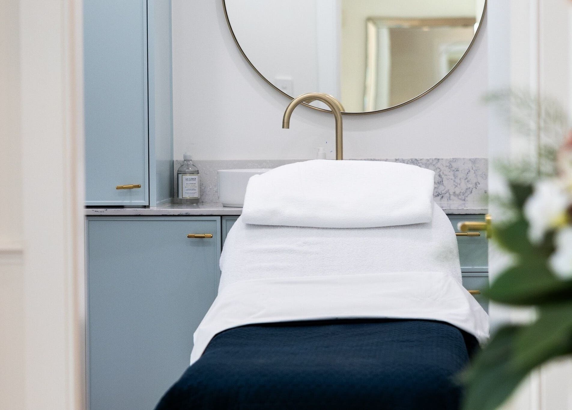 Relaxing treatment room at Studio Ap & Co, Neutral Bay, New South Wales, AU, features a plush spa bed and elegant decor.