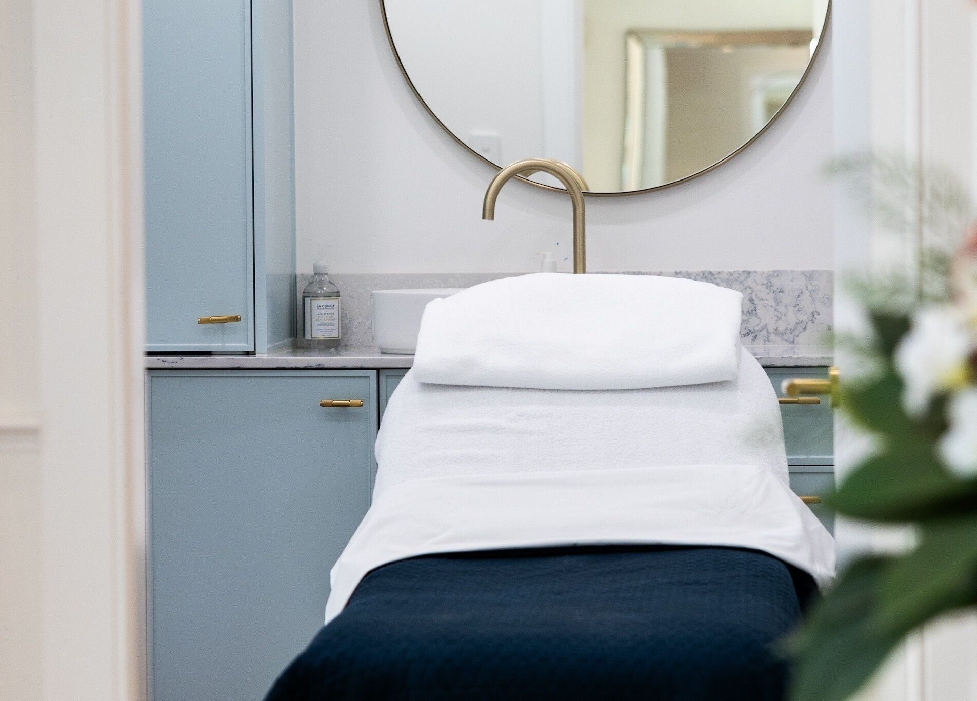 Relaxing treatment room at Studio Ap & Co, Neutral Bay, New South Wales, AU, features a plush spa bed and elegant decor.