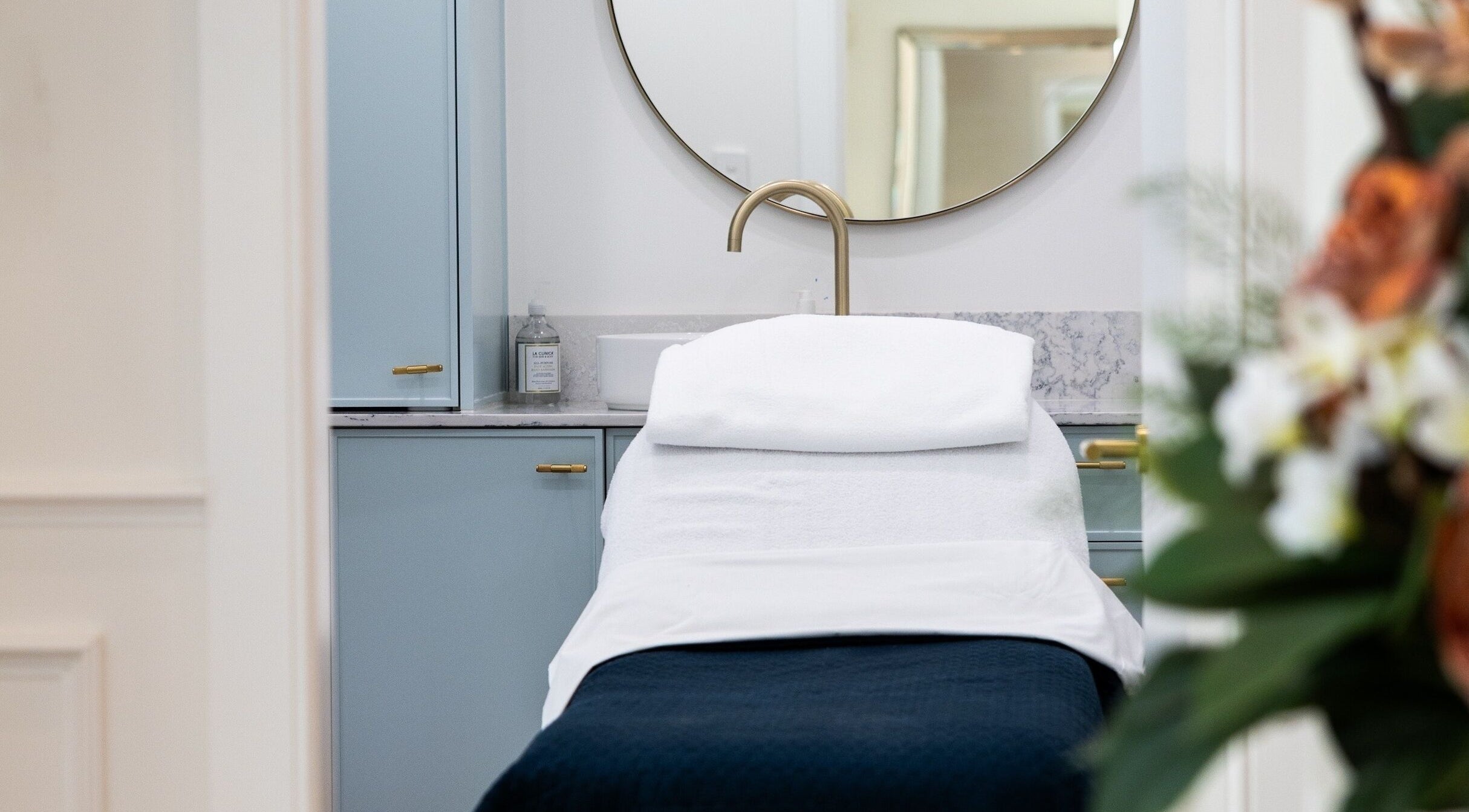 Relaxing treatment room at Studio Ap & Co, Neutral Bay, New South Wales, AU, features a plush spa bed and elegant decor.