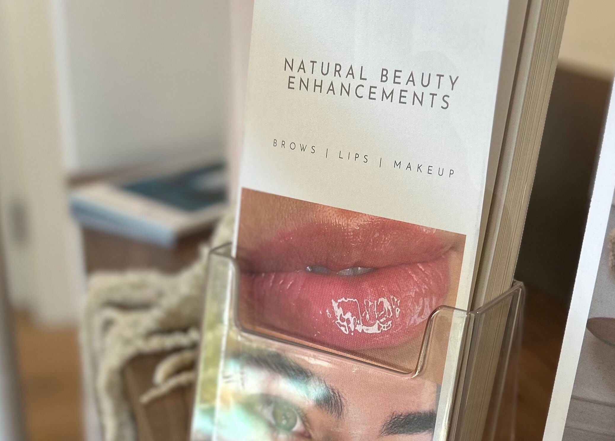 Beauty brochure at Studio Ap & Co in Neutral Bay, New South Wales, AU showcasing enhancements for brows and lips.