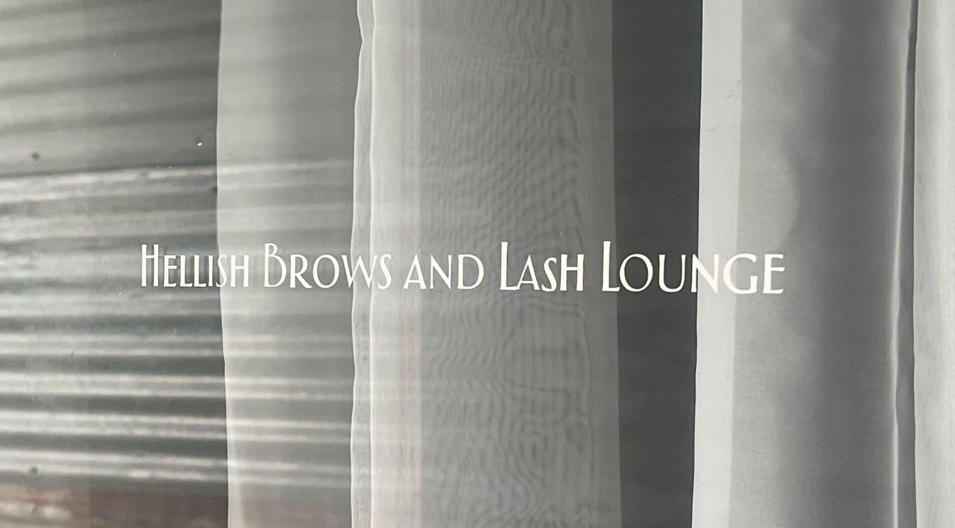 Entrance signage of Hellish Brows and Lash Lounge, Forest Hill, Queensland, AU on glass door.