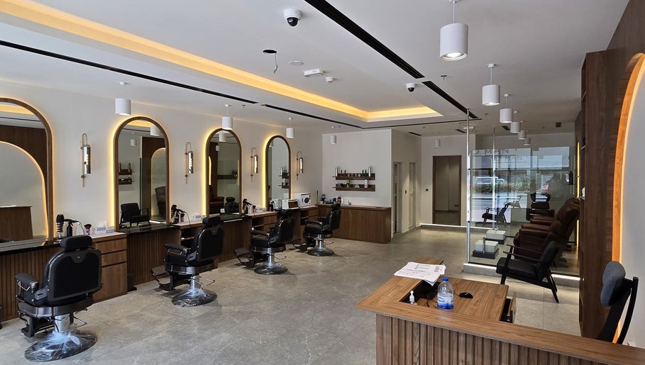 Stylish interior of The Good Man salon in Dubai, Dubai, AE, featuring modern barber chairs and sleek decor.