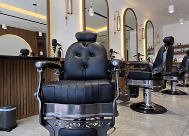 Luxurious barber chair setup at The Good Man, Dubai, Dubai, AE, showcasing modern design and comfort.