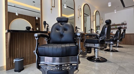 Luxurious barber chair setup at The Good Man, Dubai, Dubai, AE, showcasing modern design and comfort.