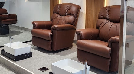 Luxurious brown pedicure chairs at The Good Man, Dubai, Dubai, AE offering comfort and style.