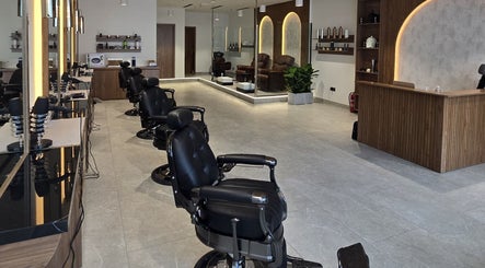 Chic barber chairs at The Good Man, Dubai, AE, offering luxurious grooming services.