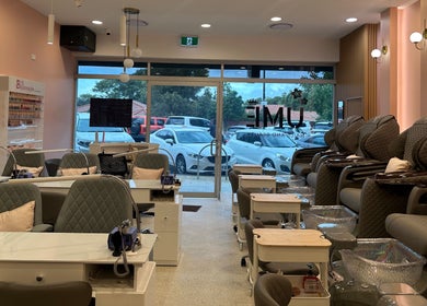 Modern interior of UME Nails and Beauty in Manning, Western Australia, AU with stylish chairs and nail stations.