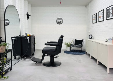 Modern salon interior at Ash Bang, Melbourne, Victoria, AU with elegant decor and styling chair.