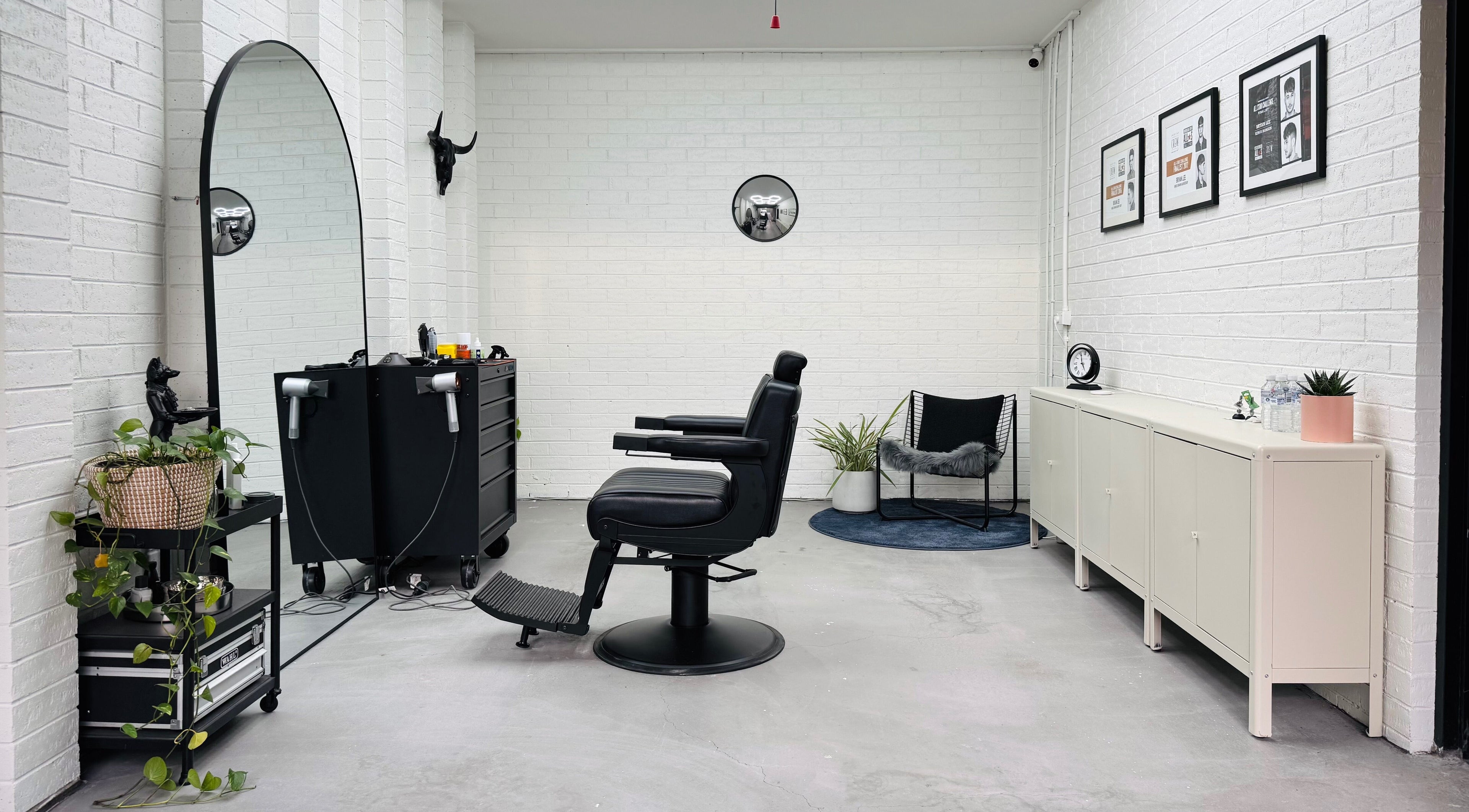 Modern salon interior at Ash Bang, Melbourne, Victoria, AU with elegant decor and styling chair.