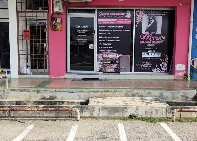 Front entrance of My'ra Salon & Beauty (Muslimah) in Sitiawan, Perak, MY, showcasing services offered.