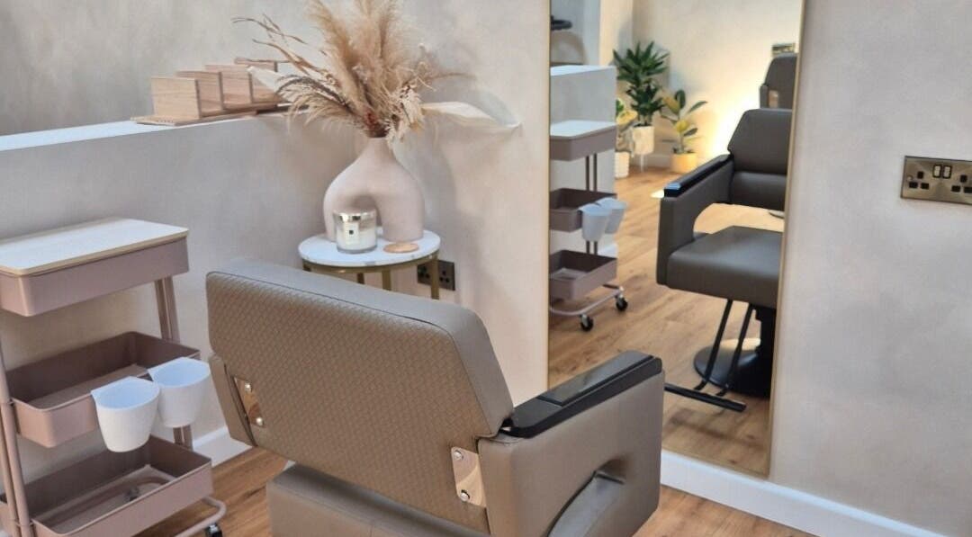 Cozy chair and decor in Sarah Louise Hair Studio, Knapwell, England, GB.