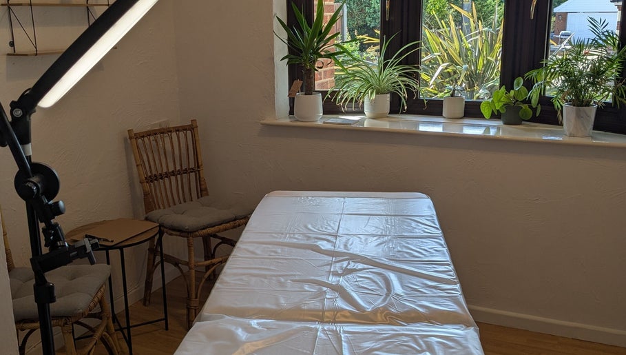 Tranquil treatment room at Microbladed by Rachel in Costessey, England, GB, featuring a cozy massage table.