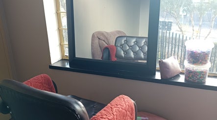 Elegant salon chairs by the window at Shimatsatsa Kids And Family Salon, Randburg, Gauteng, ZA.
