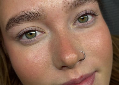 Close-up of a woman's face highlighting natural beauty at Sculpted by Sylvie, Gainsborough, England, GB.