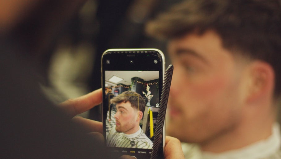 A stylish haircut captured in a mirror at Fade O Clock, Dublin, County Dublin, IE.
