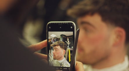 A stylish haircut captured in a mirror at Fade O Clock, Dublin, County Dublin, IE.