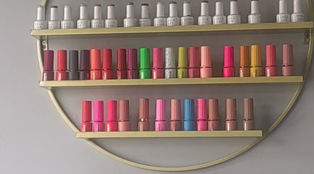 Colorful nail polish shelves at Pruddy's Beauty Studio, Benoni, Gauteng, ZA. A vivid beauty collection.