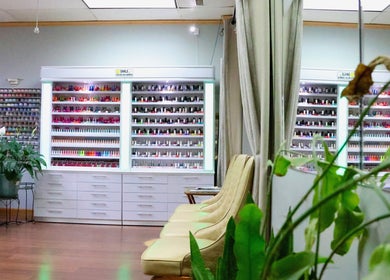Interior of Ten Perfect Nail Design in Lowell, Massachusetts, showcasing vibrant nail polish displays.