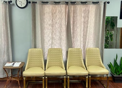 Inviting waiting area with elegant chairs at Ten Perfect Nail Design, Lowell, Massachusetts, US.