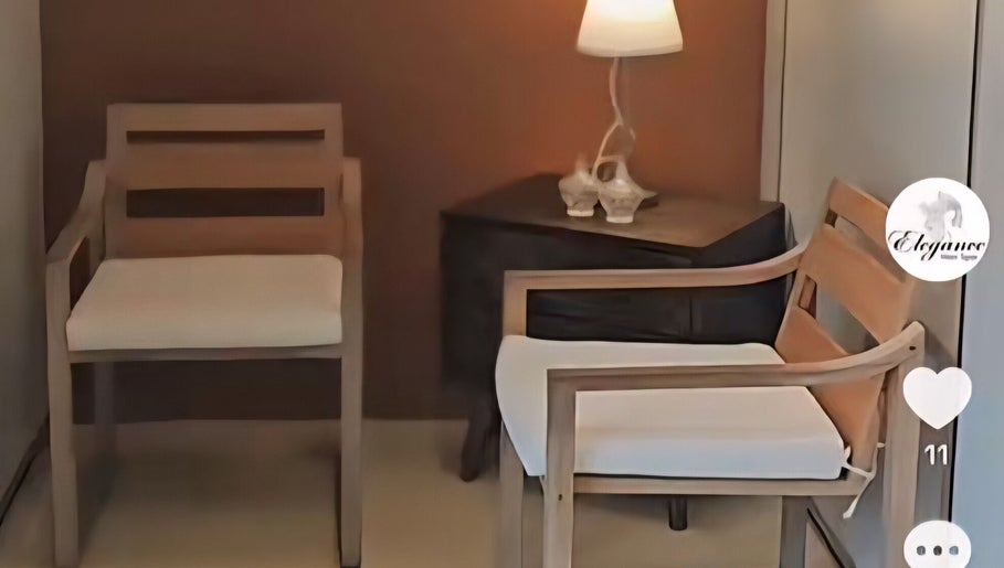 Elegant waiting area with wooden chairs at Elegance Hair Spa, Pagoh, Johor Darul Ta'zim, MY.