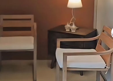 Elegant waiting area with wooden chairs at Elegance Hair Spa, Pagoh, Johor Darul Ta'zim, MY.