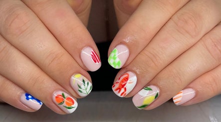 Floral nail art at Angel Glow by Vesi in London, GB showcases vibrant, intricate designs.