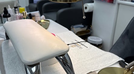 Manicure station at Angel Glow by Vesi, London, GB. Elegant setup with comfy seating and nail tools.