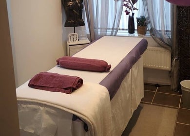 Tranquil massage room at Relax with Me Body Massage, Columbia, South Carolina, US, featuring a cozy table.