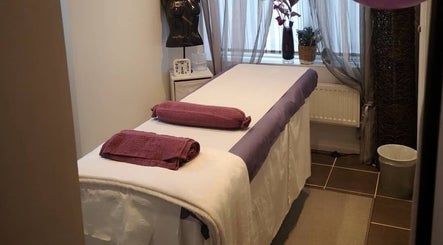 Tranquil massage room at Relax with Me Body Massage, Columbia, South Carolina, US, featuring a cozy table.