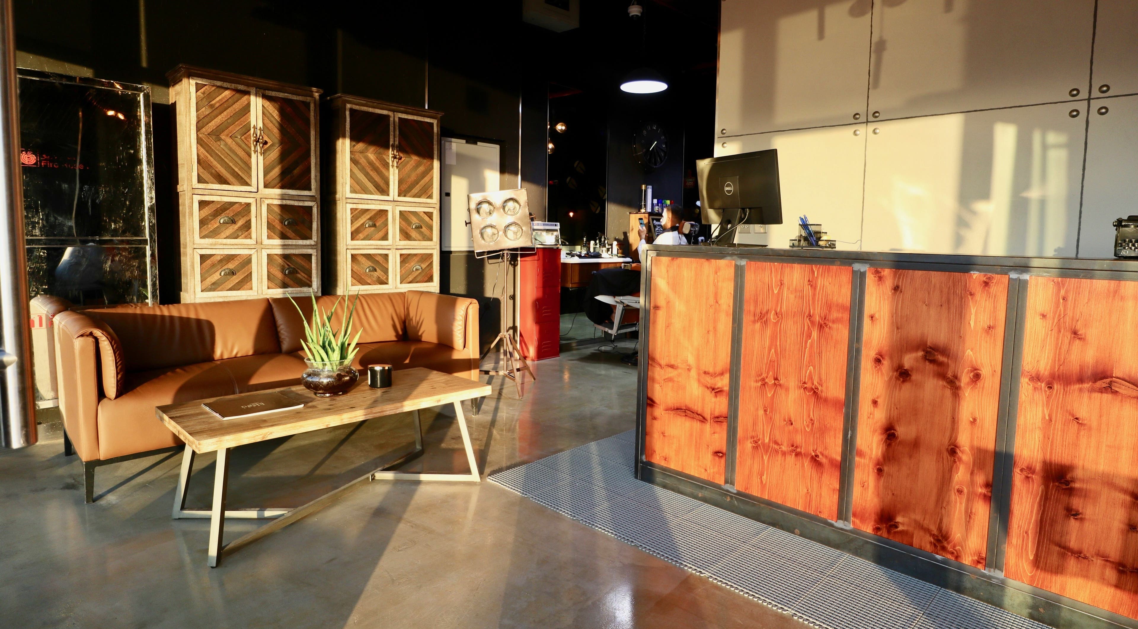 Reception area at Barbers Gentlemen Saloon, Dubai, AE with elegant decor and comfortable seating.