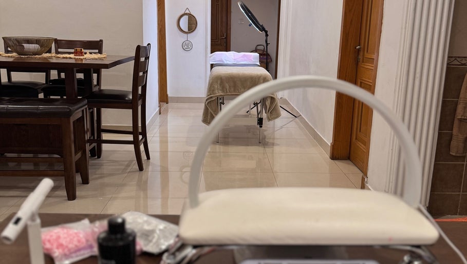 Chic beauty therapy room at The Beauty Spot, Jeddah, SA, with a massage table and stylish decor.