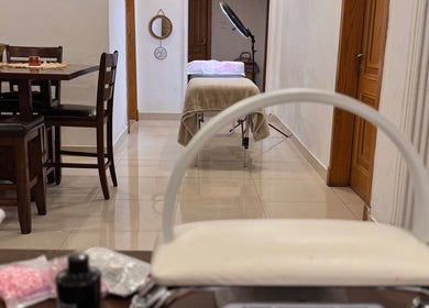Chic beauty therapy room at The Beauty Spot, Jeddah, SA, with a massage table and stylish decor.