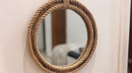 Rope-framed mirror at The Beauty Spot, Jeddah, SA, adding a rustic touch to the wellness venue decor.