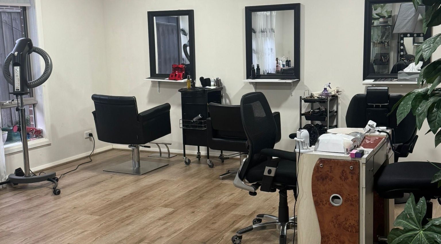 Modern interior of Hair Focus Salon in Melbourne, Victoria, AU. Stylish chairs and mirrors create a relaxing ambiance.