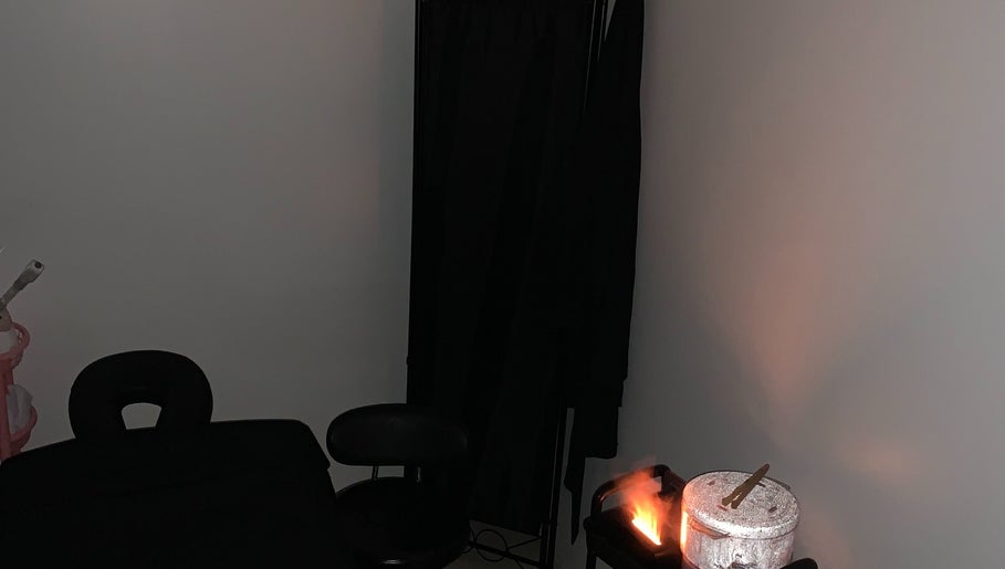 Relaxing treatment room at Studio Delights in Nassau, New Providence, BS, featuring massage and spa essentials.