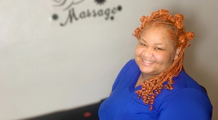 Smiling stylist at Studio Delights, Nassau, New Providence, BS offering beauty services.