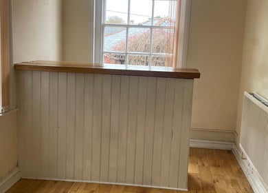 Bright corner at The Beauty Ritualist | Wellness Clinic, Ipswich, England, featuring a radiator and sunny window view.